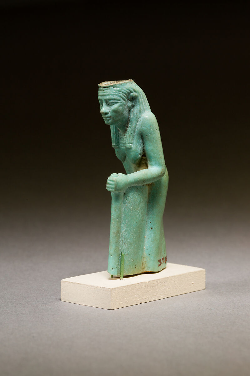 Statuette of a worn or aged woman, probably a goddess, Faience 