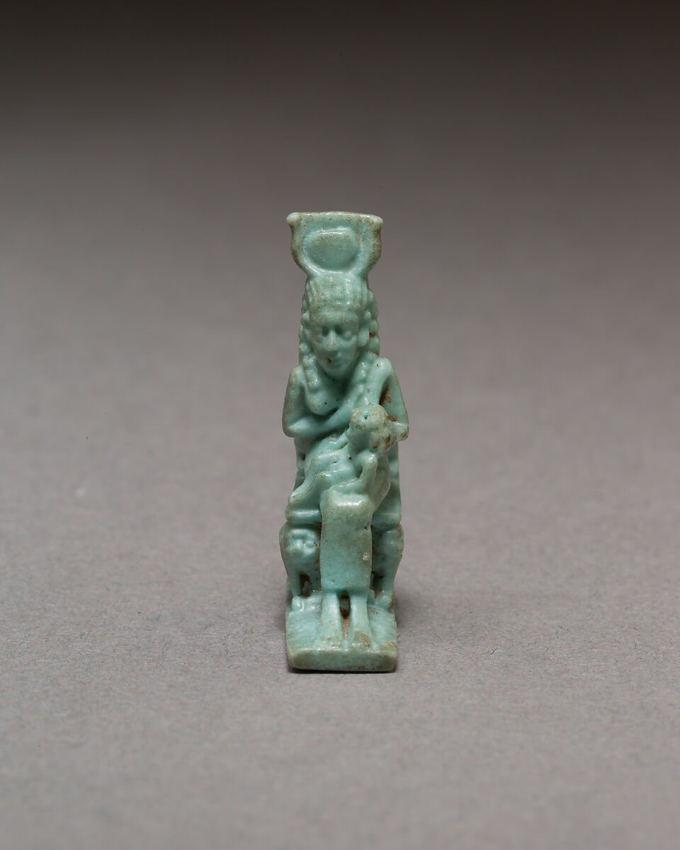 Isis nursing Horus on throne supported by striding lions, Blue faience