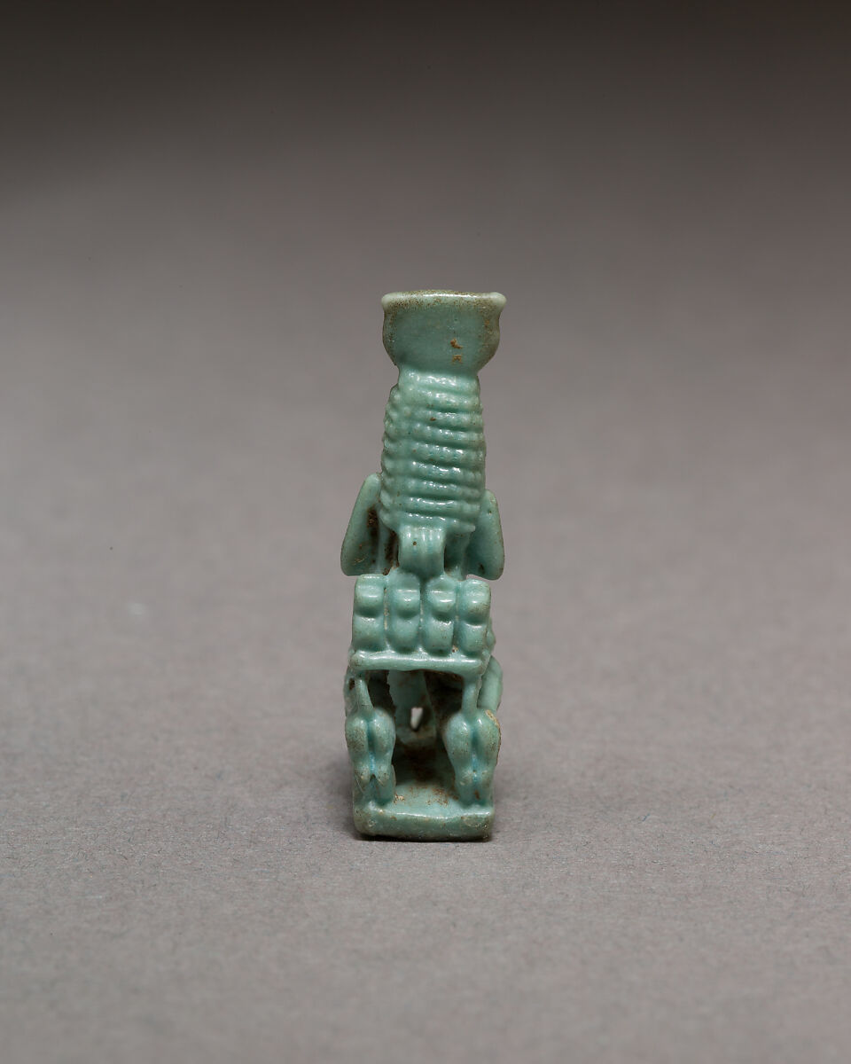 Isis nursing Horus on throne supported by striding lions, Blue faience