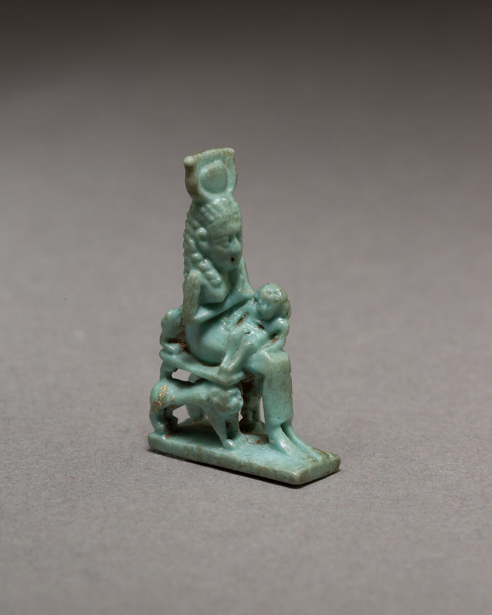 Isis nursing Horus on throne supported by striding lions, Blue faience 