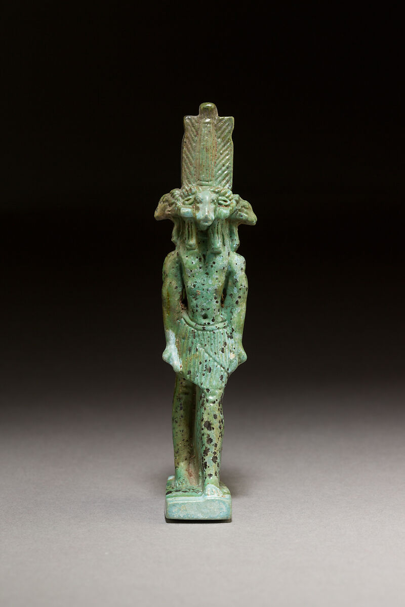 God with four ram heads facing in four directions, probably Khnum, Faience 