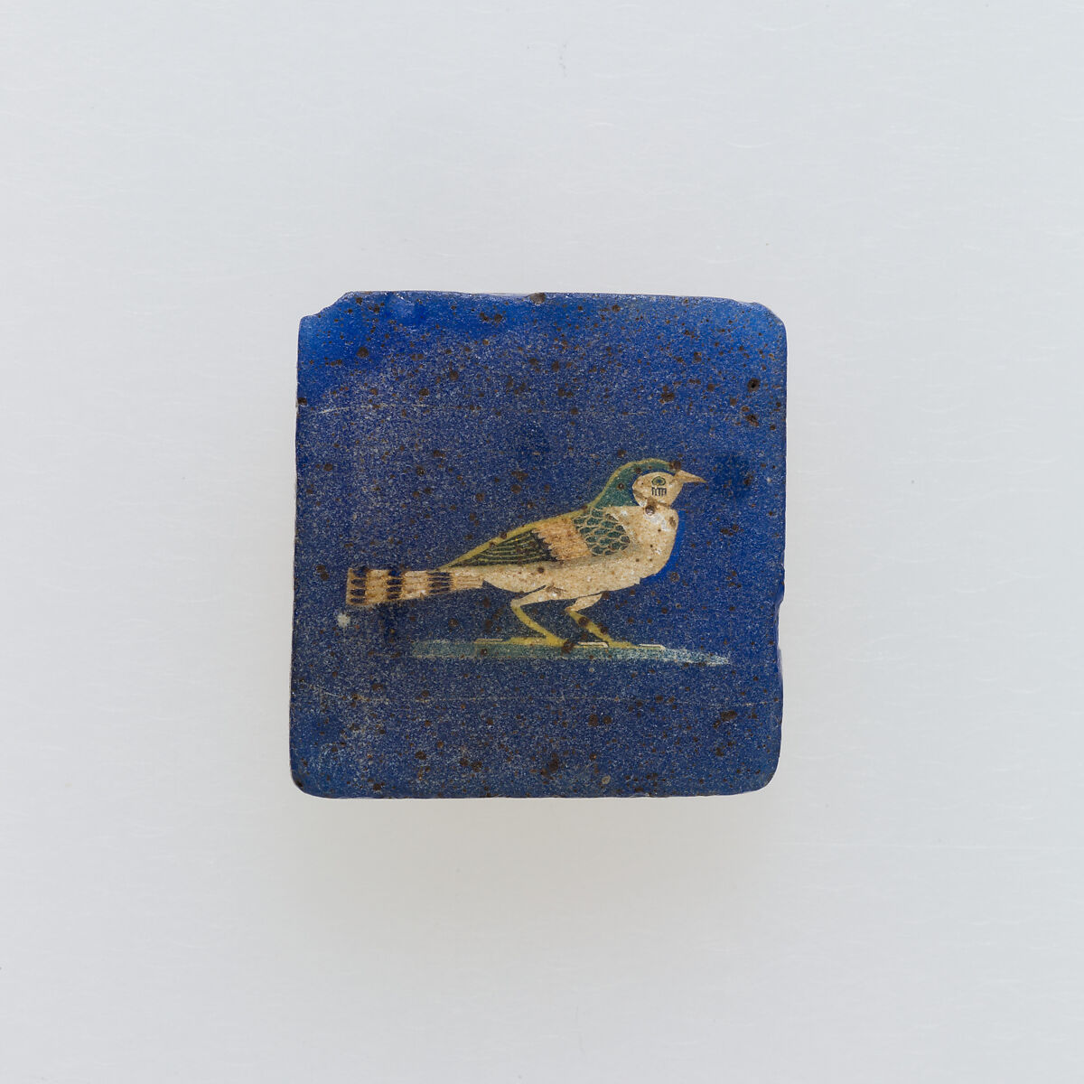 A swallow, a solar symbol, in an rectangular inlay, Glass 
