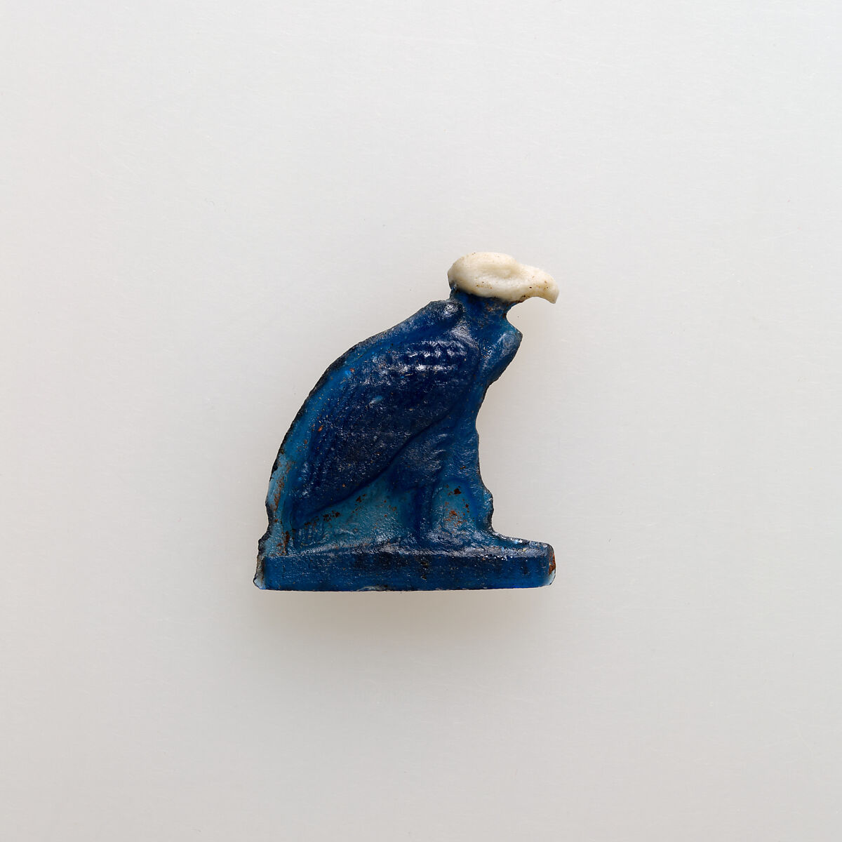 Vulture amulet, Glass 