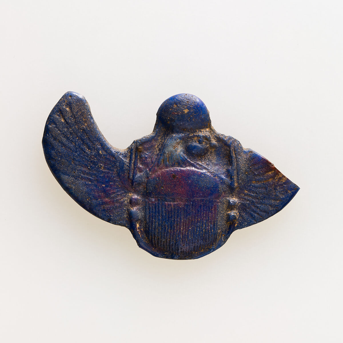 Amulet of winged scarab with falcon head, Glass 
