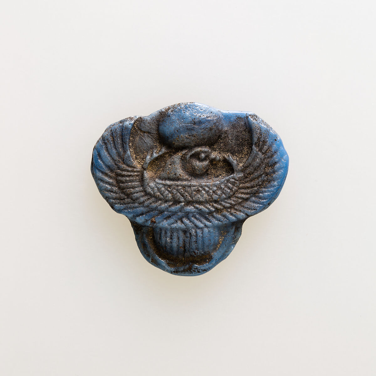 Amulet of winged scarab with falcon head, Glass 