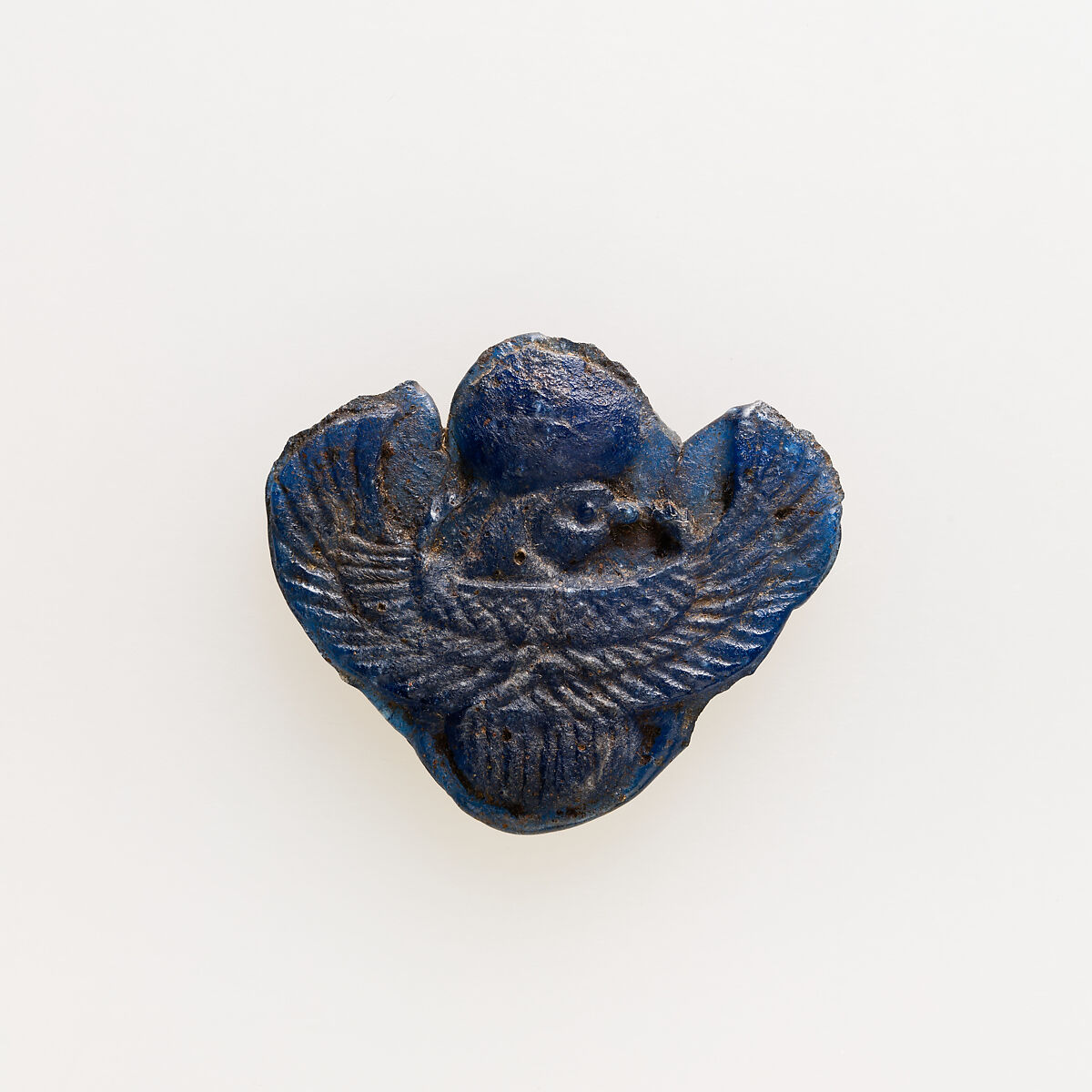 Amulet of winged scarab with falcon head, Glass 