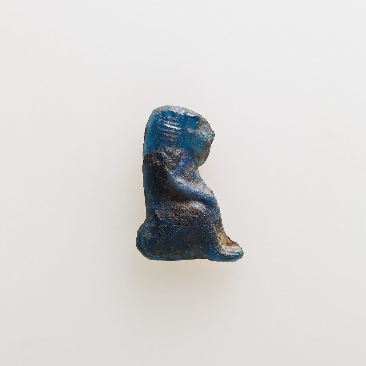 Amulet of squatting baboon, Glass 