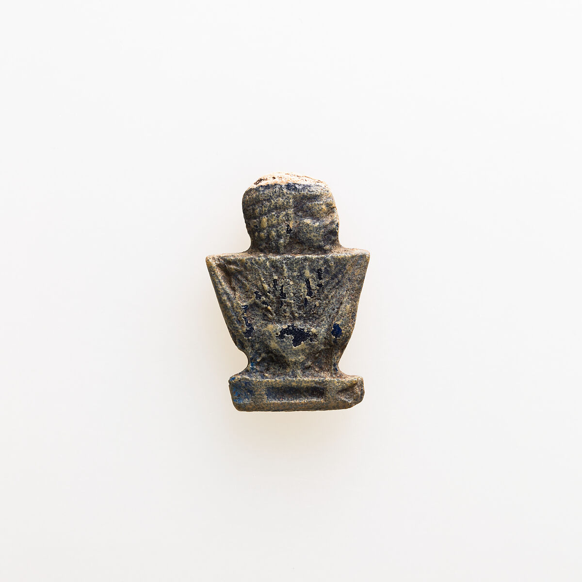 Amulet depicting human head emerging from lotus, Glass 
