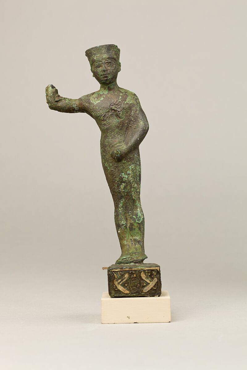 Statuette of Amenopet naming the provider/beneficiary  Amenirdis son of Horiaa, cuperous metal, precious metal inlay 