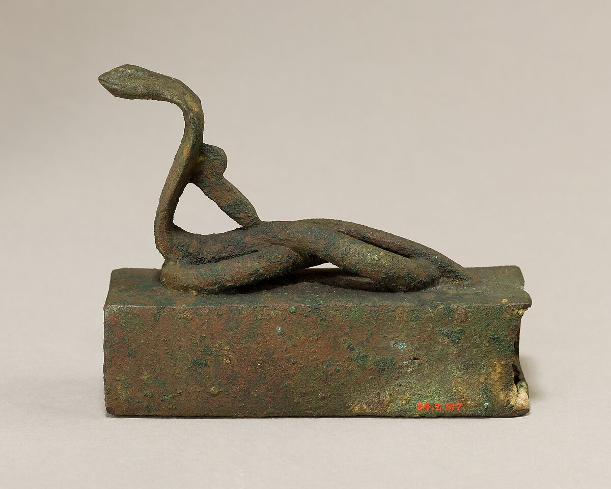 Box for an animal mummy surmounted by a coiled, rearing snake, Cupreous metal 