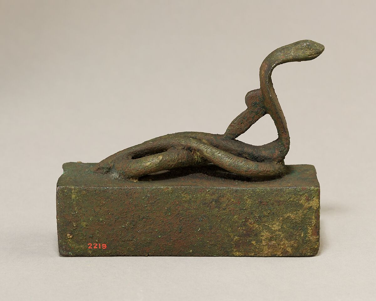 Box for an animal mummy surmounted by a coiled, rearing snake, Cupreous metal