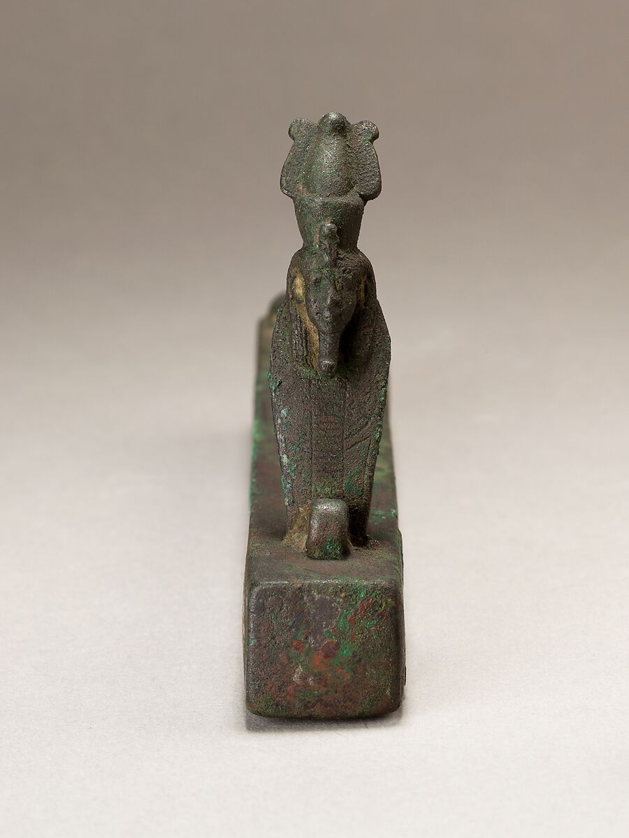 Atum as a human-headed cobra surmounting a box for an animal mummy, Cupreous metal