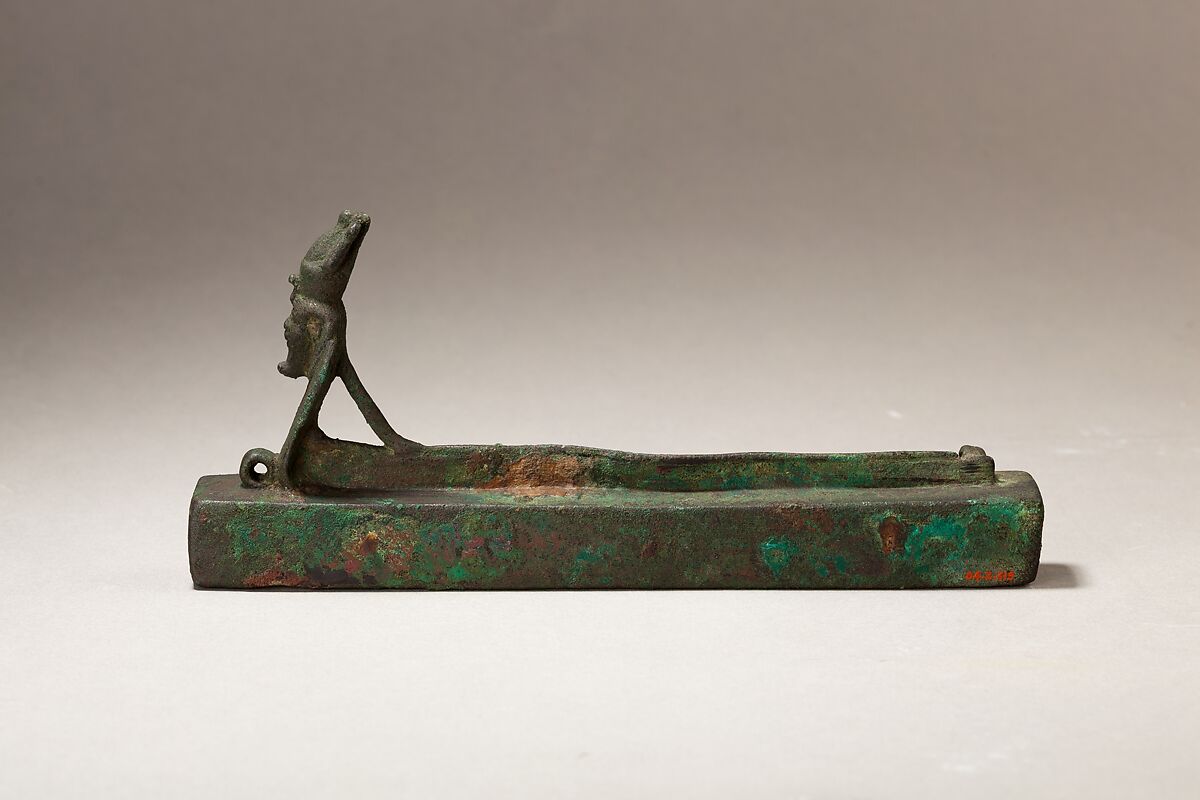 Atum as a human-headed cobra surmounting a box for an animal mummy, Cupreous metal