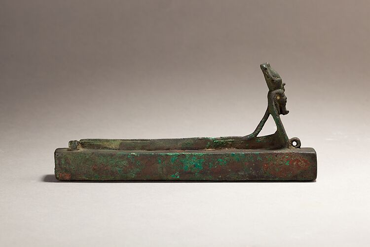 Atum as a human-headed cobra surmounting a box for an animal mummy
