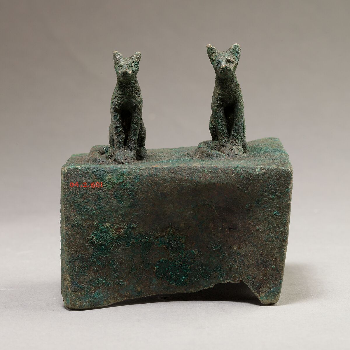 Two cats surmounting a box for an animal mummy, Cupreous metal 