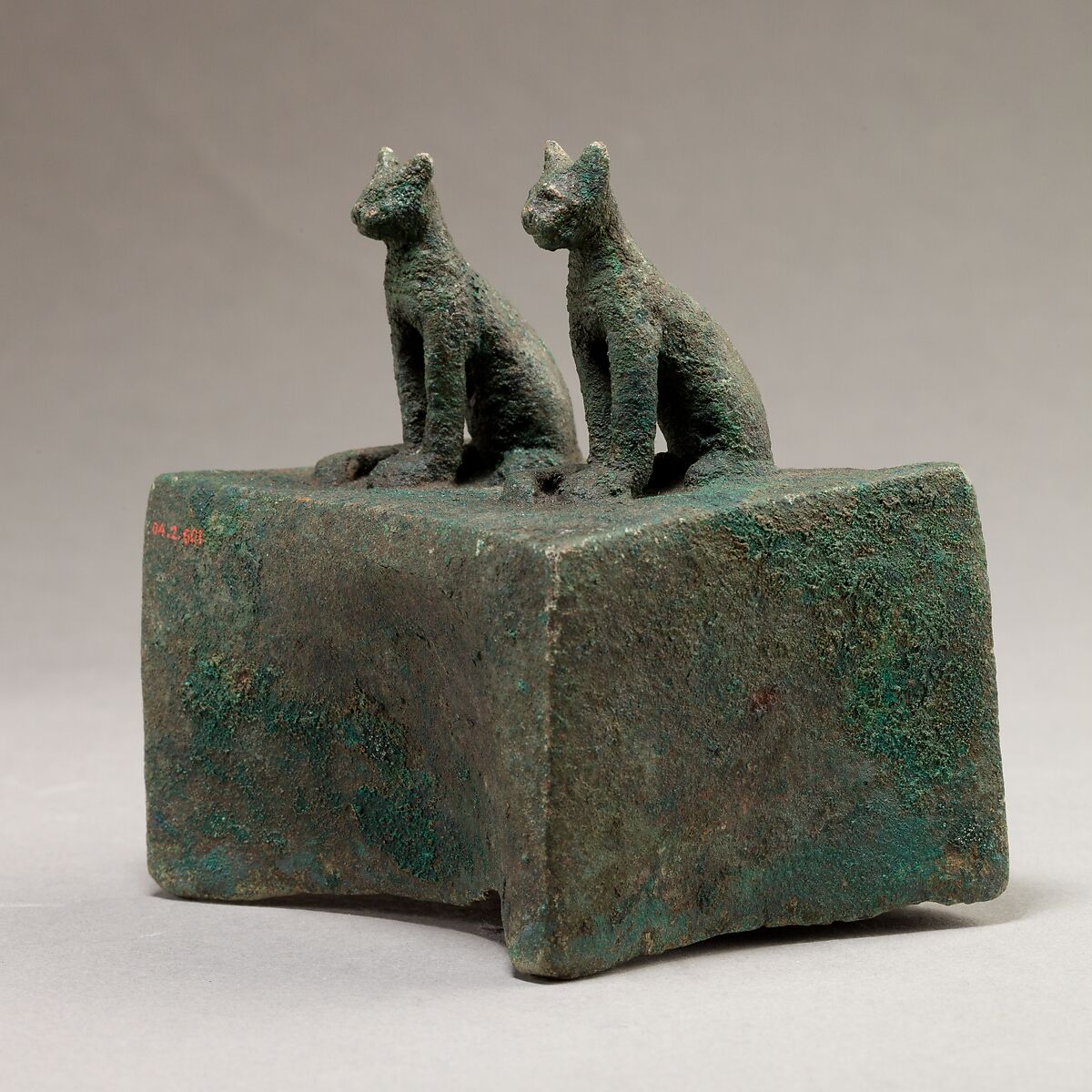 Two cats surmounting a box for an animal mummy, Cupreous metal