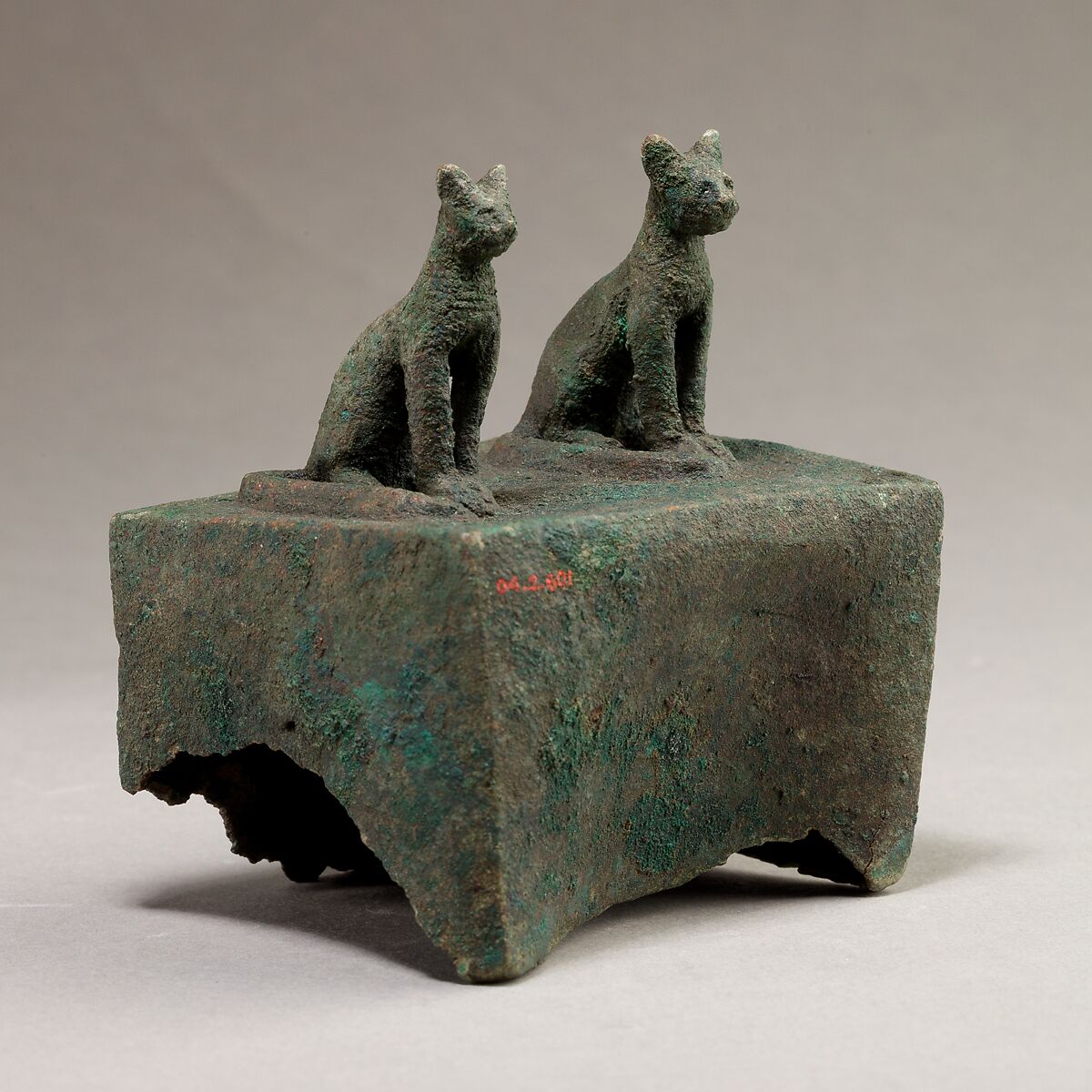 Two cats surmounting a box for an animal mummy, Cupreous metal