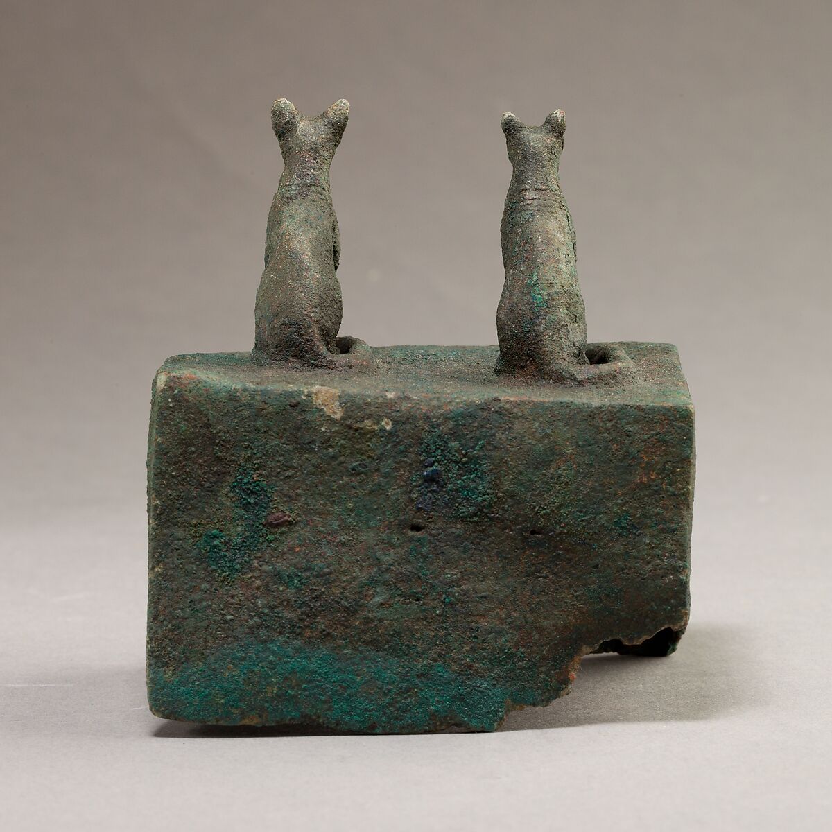Two cats surmounting a box for an animal mummy, Cupreous metal