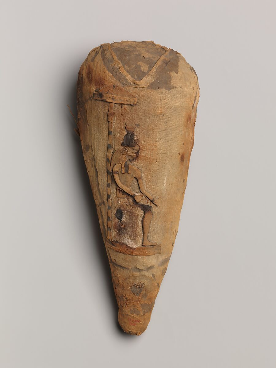 Sacred animal mummy in the form of an ibis decorated with appliqué of Ibis-headed god, Dyed and undyed linen, animal remains, mummification materials 