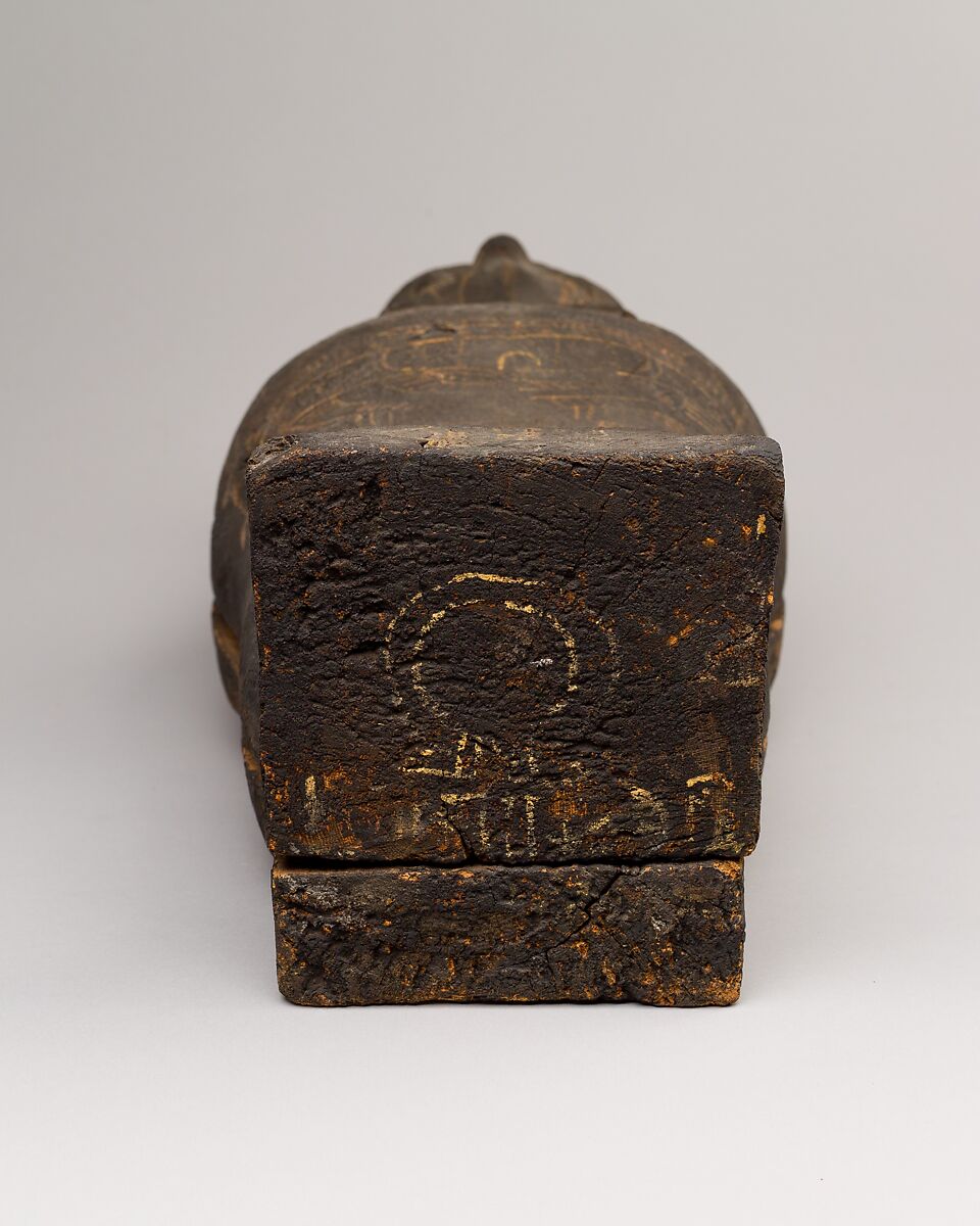 Coffin and corn mummy with Osiris mask, coffin: wood, paint 
mummy: grain, sand, clay and/or soil, resin, linen bandages 
mask: wax