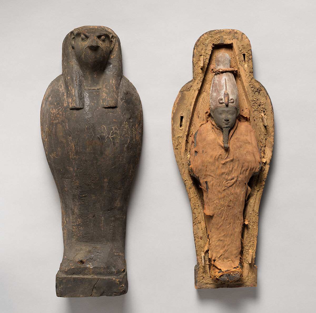 Falcon-headed coffin and grain mummy with Osiris mask, Coffin: Wood, paint; Mummy: Linen bandages; Mask: Wax
