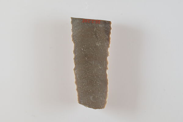 Fragment of a denticulated tool (?), Flint