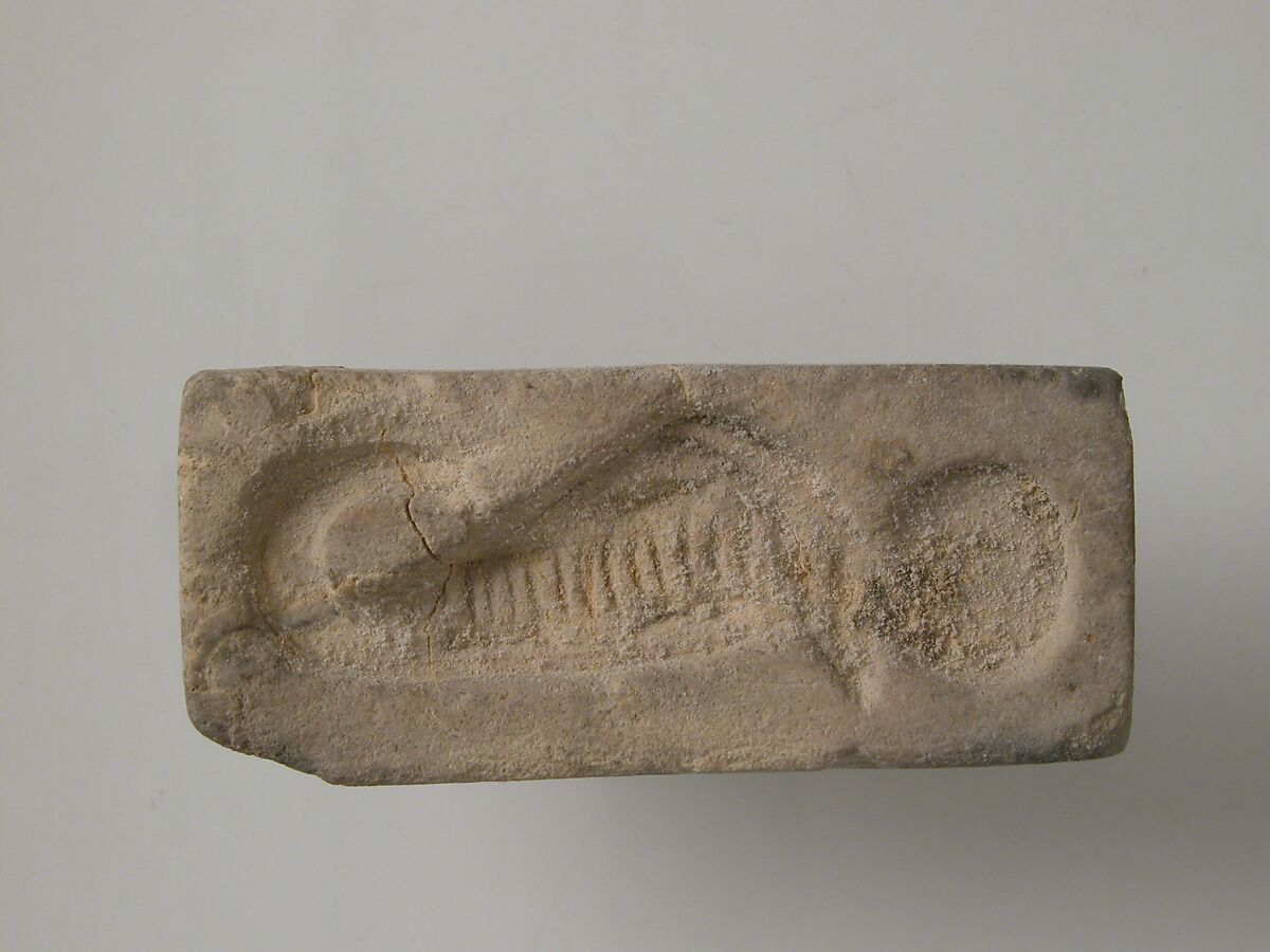 Stamp with uraeus and sun disk, Limestone 