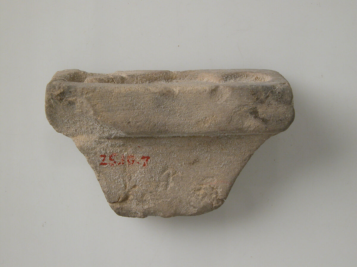 Stamp with uraeus and sun disk, Limestone