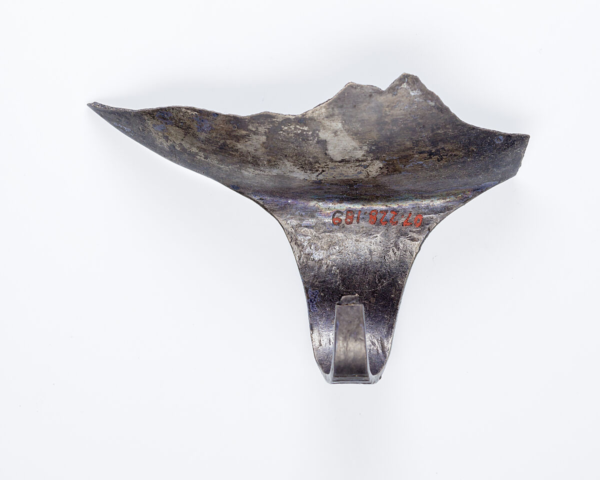 Rim fragment with handle from a shallow strainer, Silver