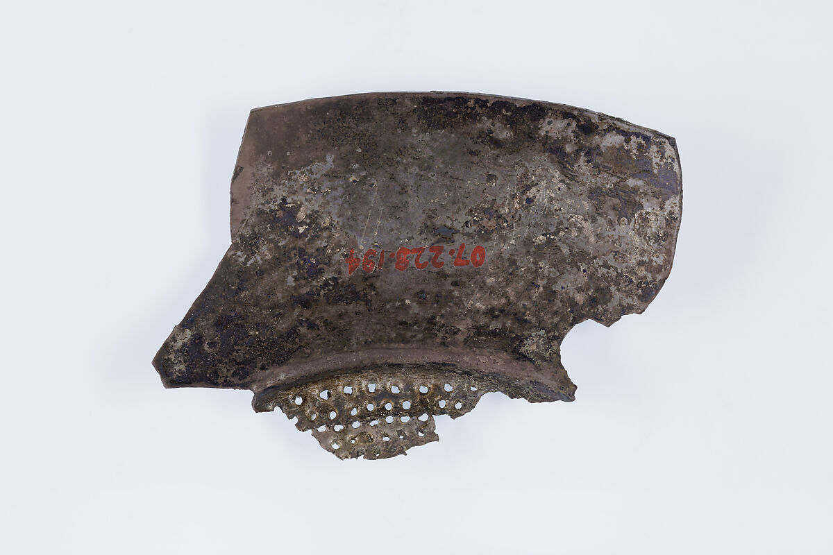 Fragment of a shallow strainer, Silver