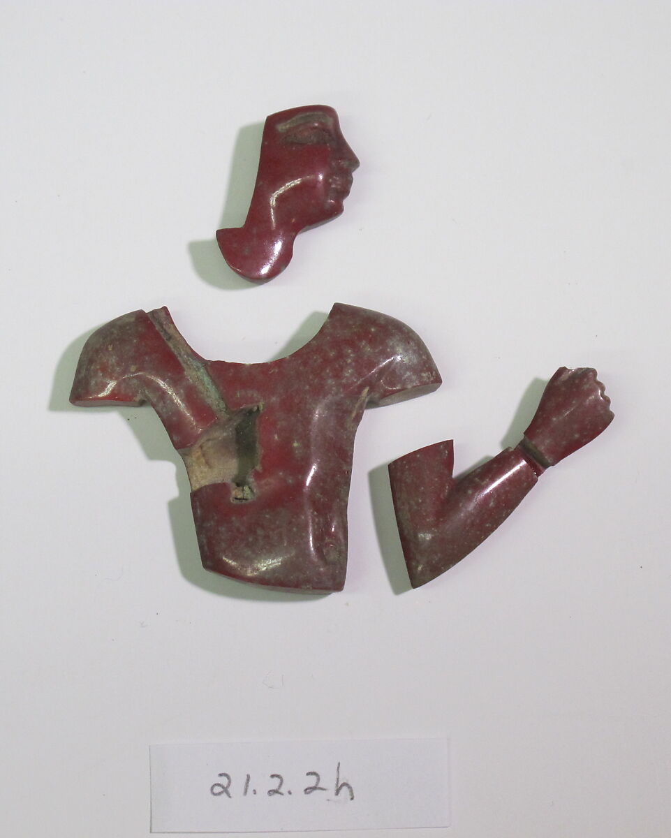 Inlays from shrine: male torso, arm with hand, Glass 