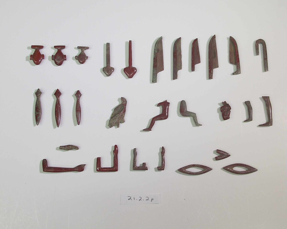 Inlays from shrine: hieroglyphs, Glass 