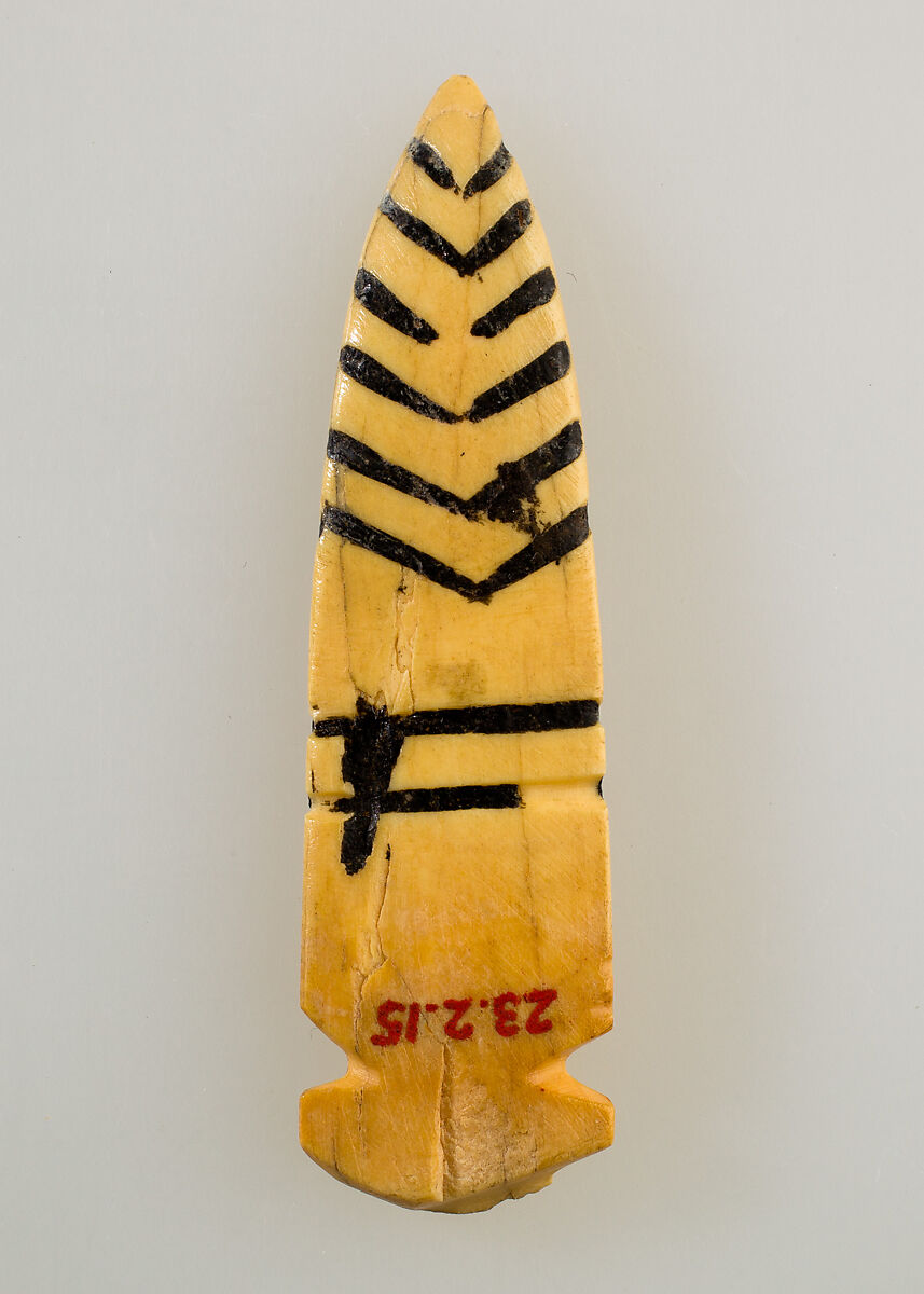 Tusk amulet, Bone