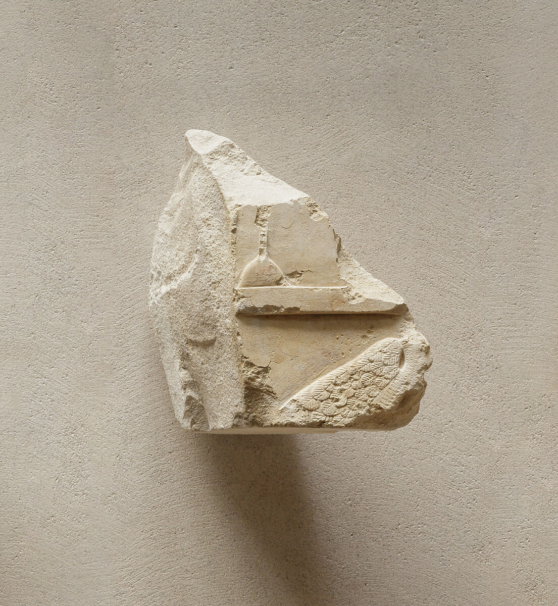 Relief fragment from a row of vulture figures, Limestone, paint 