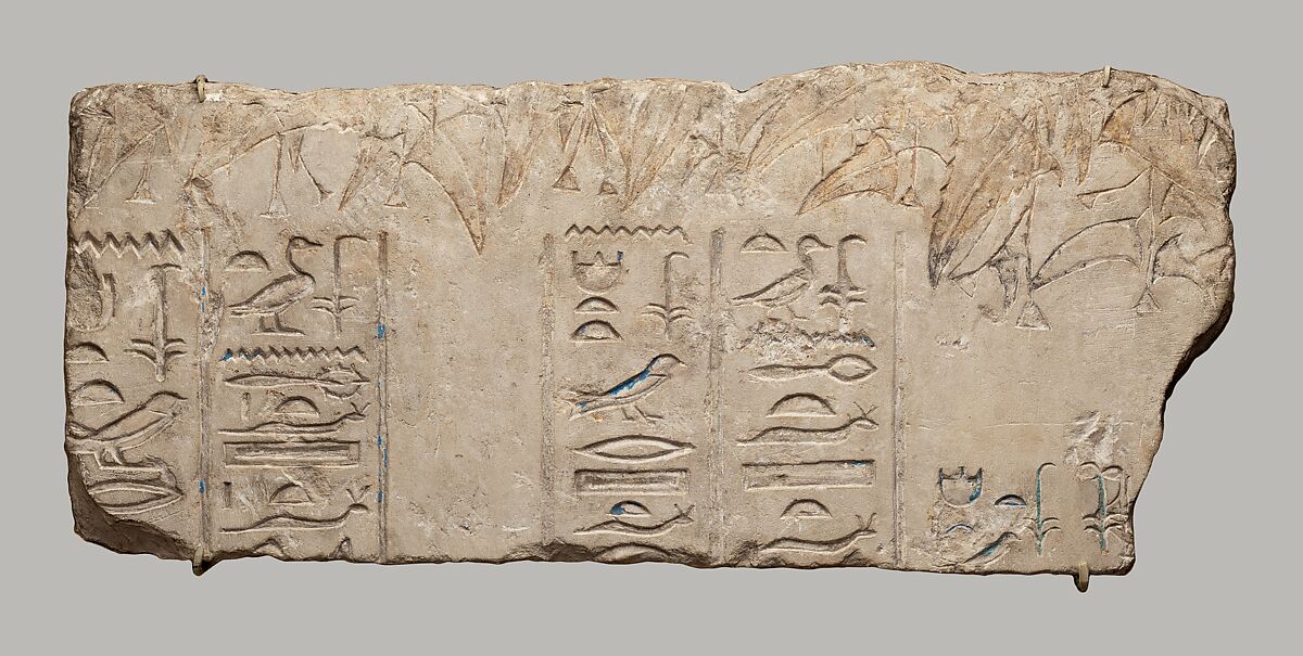 Relief fragment with large scale vine and inscription referring to daughters of Akhenaten, Limestone, paint 