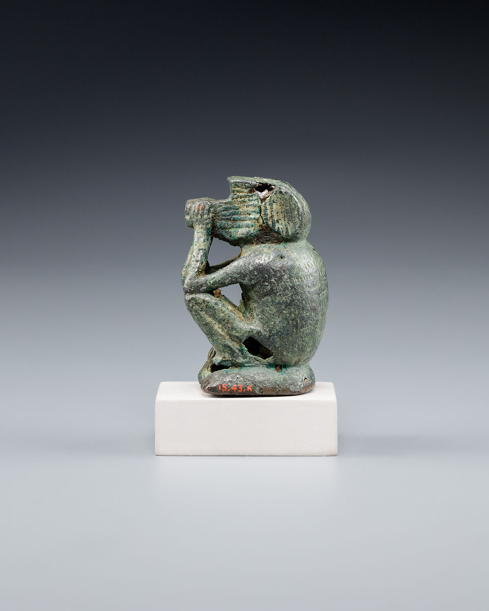 Figure of a squatting cynocephalus ape, Bronze or copper alloy