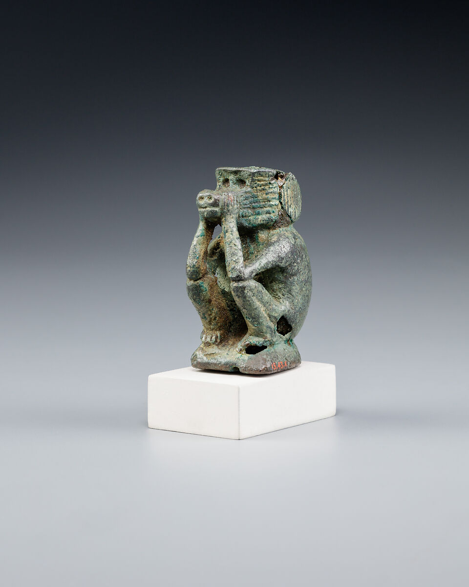 Figure of a squatting cynocephalus ape, Bronze or copper alloy