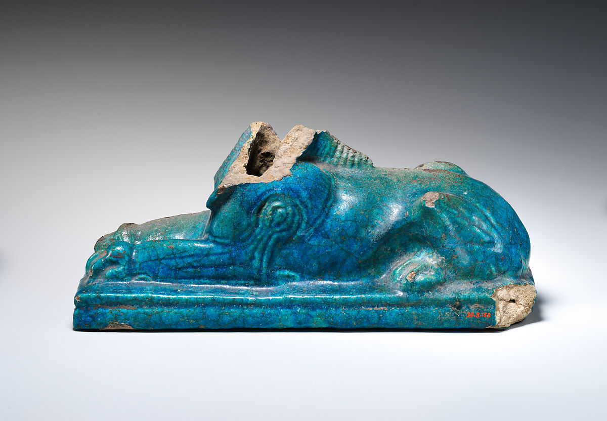 Sphinx with head broken away, Faience