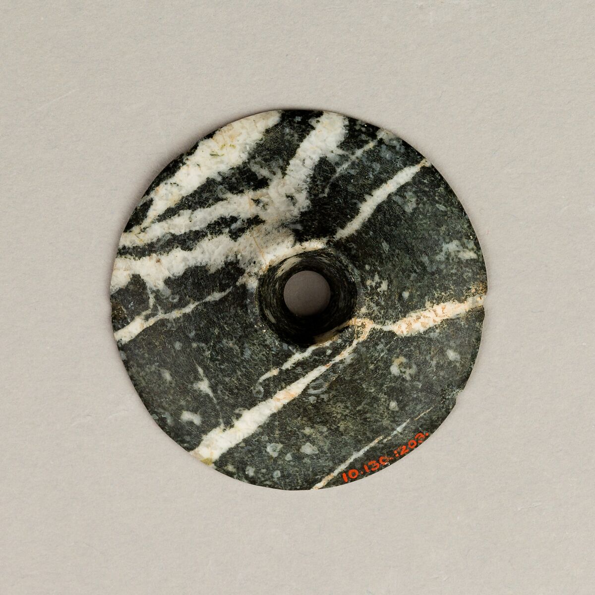 Disc-shaped mace head, Porphyry