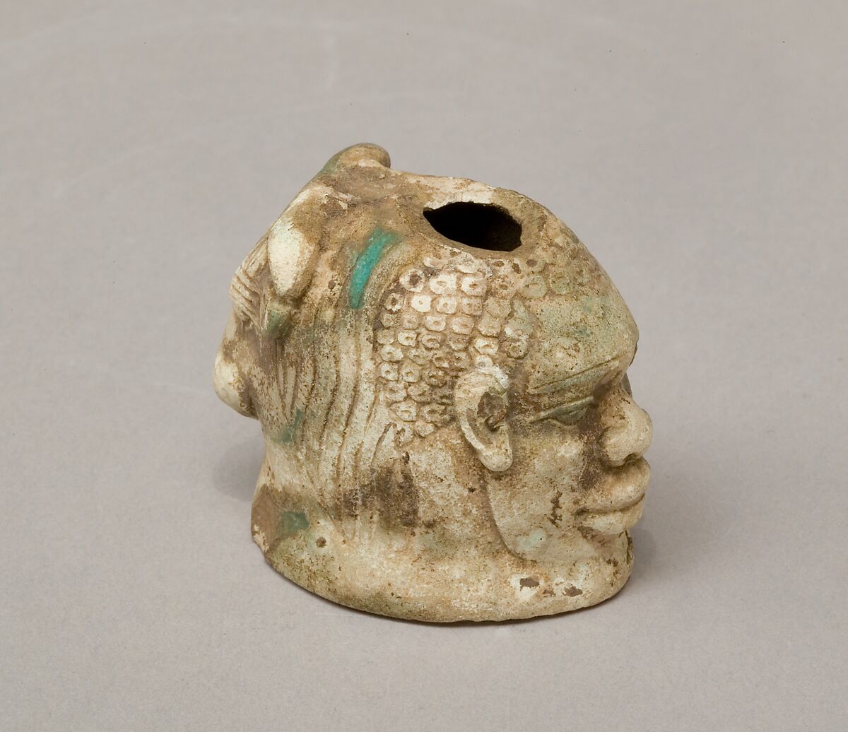Janus-faced aryballos depicting a Nubian and a bull, Faience