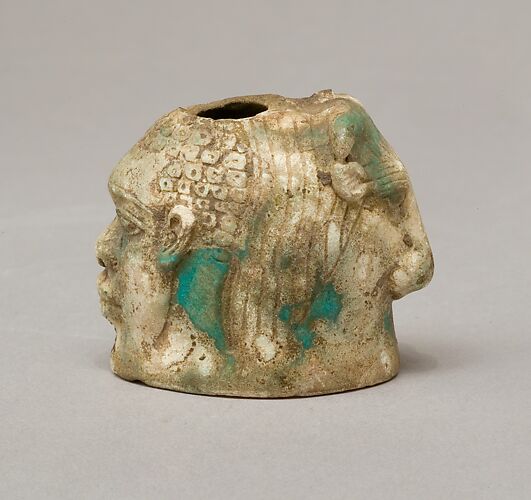 Janus-faced aryballos depicting a Nubian and a bull