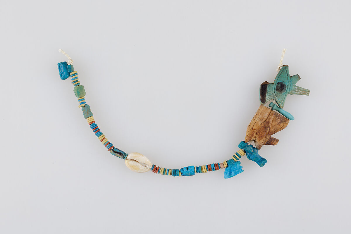 String of Beads and Amulets, Faience, shell, wood 