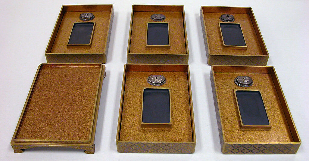 Set of Five Writing Boxes with Japanese Globeflowers, Plum Blossoms, and Interlaced Roundels, Lacquered wood with gold and silver hiramaki-e and applied gold foil on nashiji ground, Japan