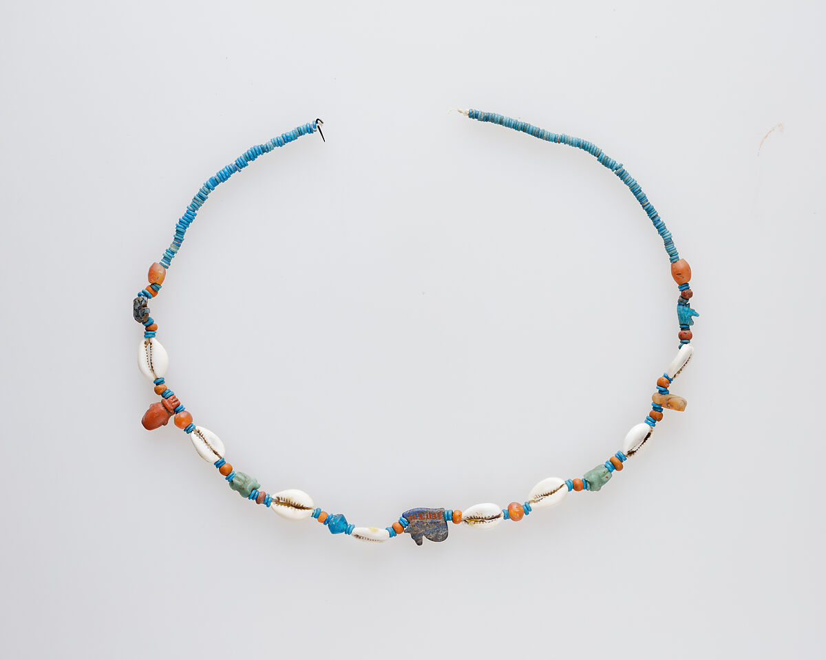 String of beads and amulets (wedjat eyes), Shell, carnelian, string and faience