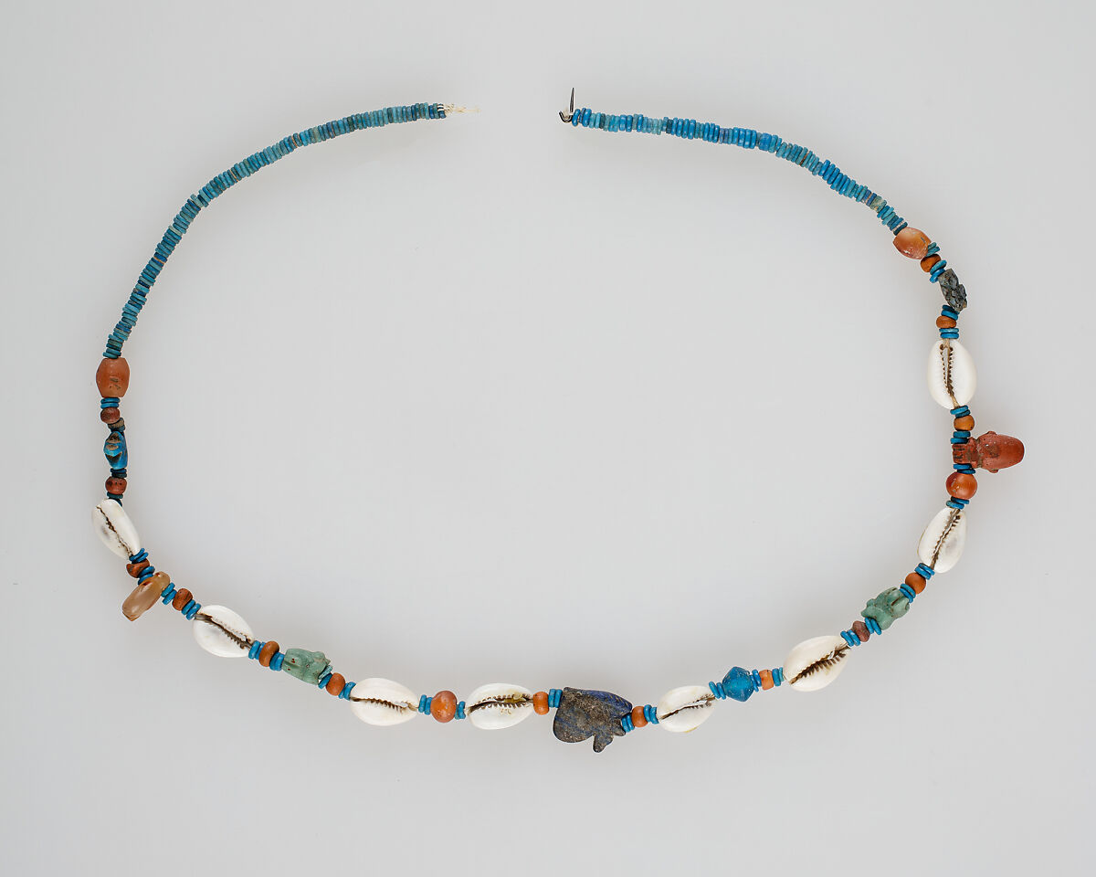 String of beads and amulets (wedjat eyes), Shell, carnelian, string and faience 