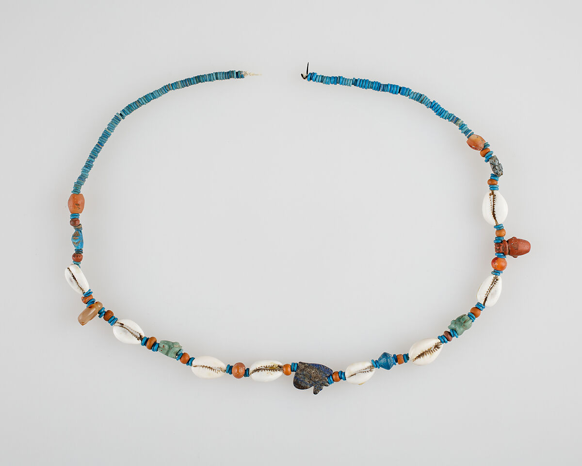 String of beads and amulets (wedjat eyes), Shell, carnelian, string and faience
