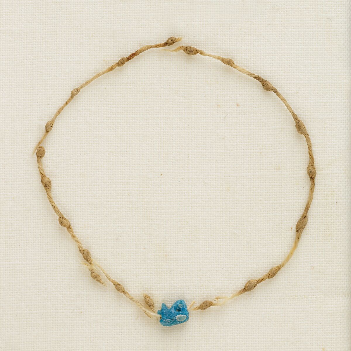 Bracelet with knots and wedjat eye, Linen, faience 