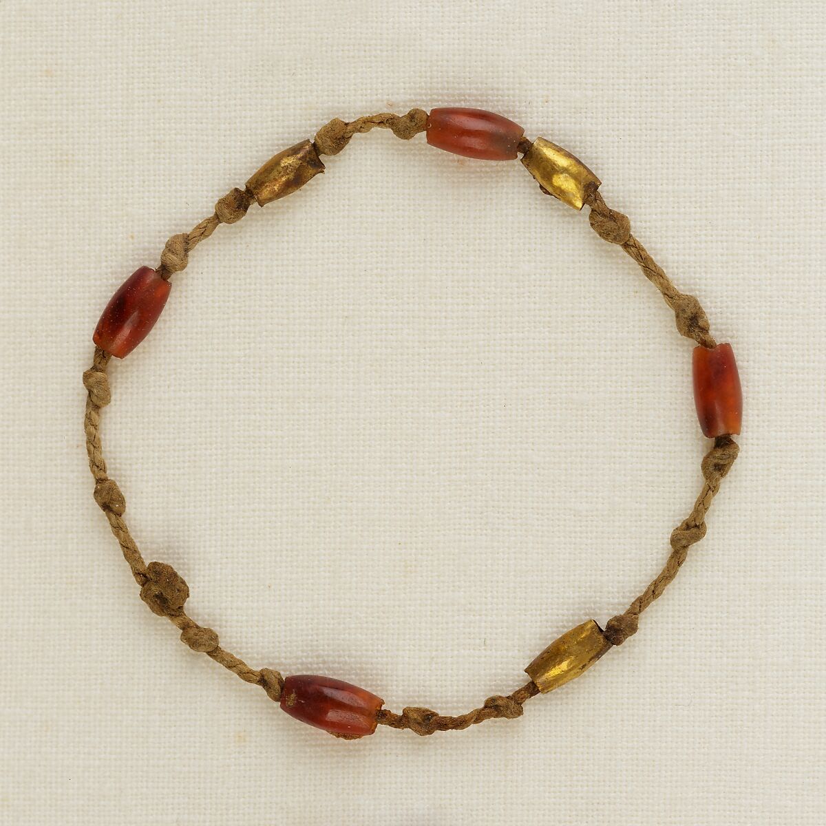 Bracelet with barrel beads, Linen, carnelian, gold 