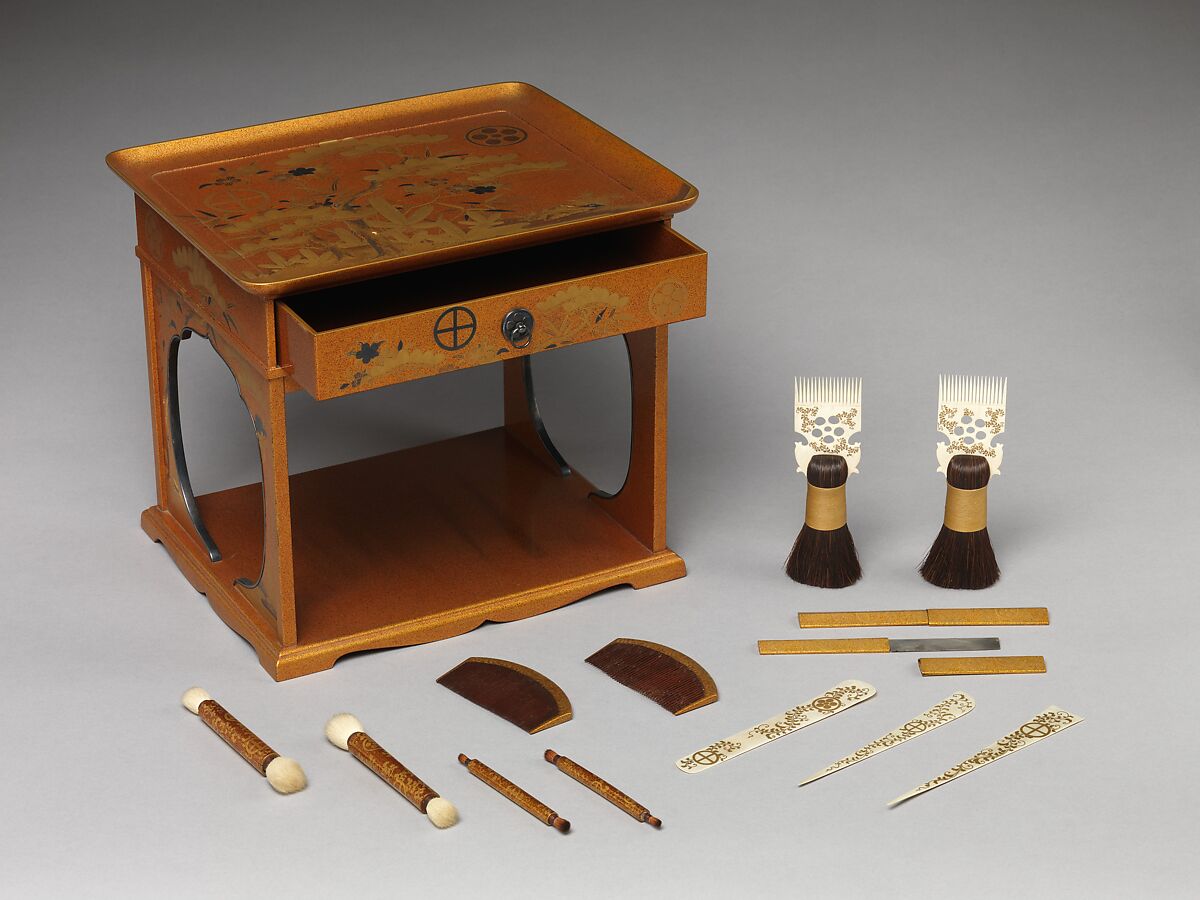 Cosmetic Stand with Pine, Bamboo, and Cherry Blossom from a Wedding Set

, Lacquered wood with gold, silver takamaki-e, hiramaki-e, cut-out gold foil application on nashiji (“pear-skin”) ground, Japan