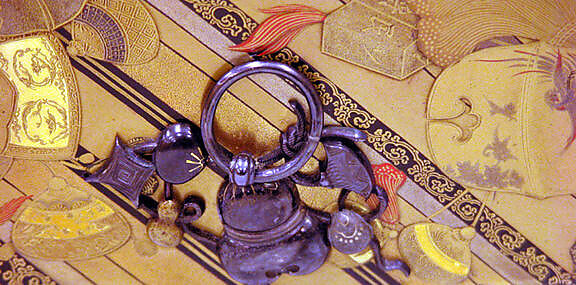 Letter box with amulets and charms, Gold, silver, red, black togidashimaki-e, hiramaki-e, takamaki-e, cut-out gold foil application on black and gold ground, Japan